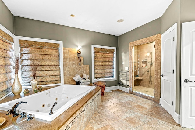 bathroom with shower with separate bathtub