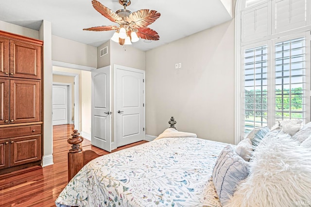 bedroom featuring ceiling fan and dark hardwood / wood-style floors