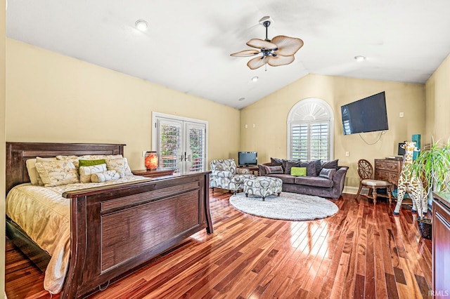 bedroom featuring multiple windows, hardwood / wood-style floors, and ceiling fan