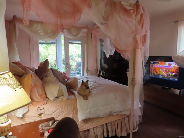 bedroom featuring access to exterior and wood-type flooring