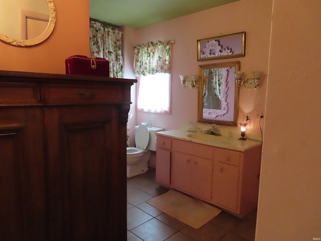 bathroom featuring vanity, toilet, and tile patterned floors