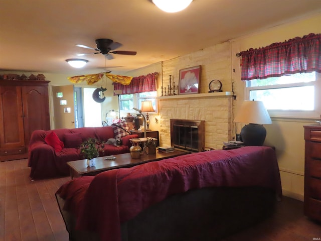 living room with hardwood / wood-style floors, ceiling fan, and a healthy amount of sunlight