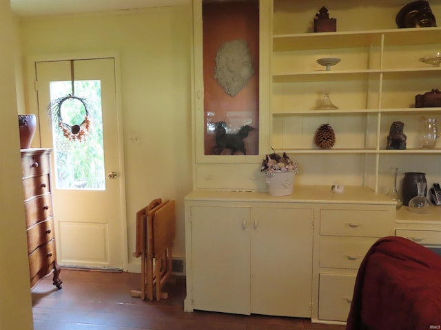 interior space featuring plenty of natural light and hardwood / wood-style floors