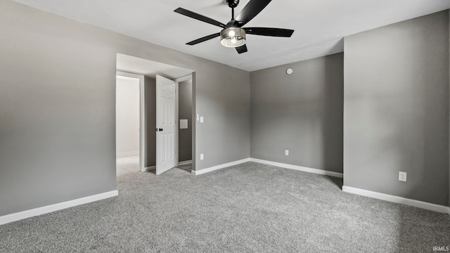 empty room with ceiling fan and light colored carpet