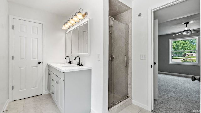 bathroom with vanity, tile patterned flooring, ceiling fan, and a shower with door