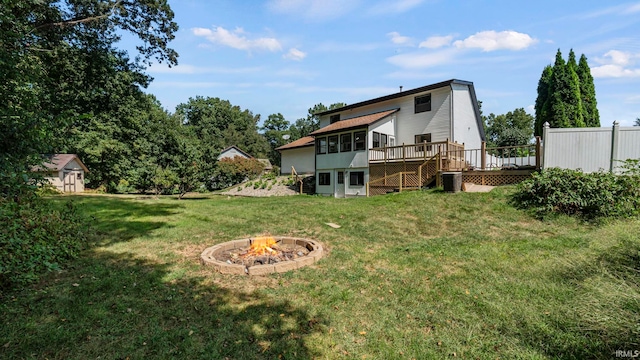 view of yard with a fire pit and a wooden deck