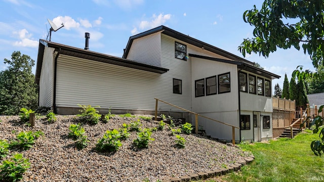 rear view of house with a lawn