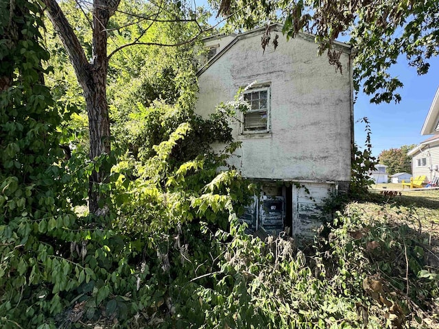 view of property exterior with stucco siding