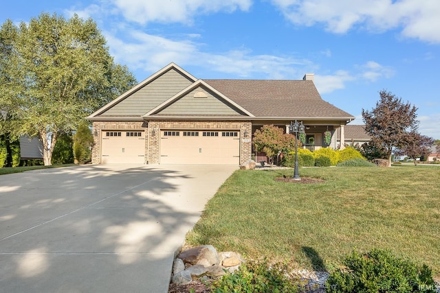 view of front of property featuring a garage and a front yard