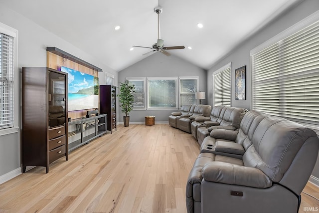 living room with lofted ceiling, ceiling fan, and light hardwood / wood-style floors