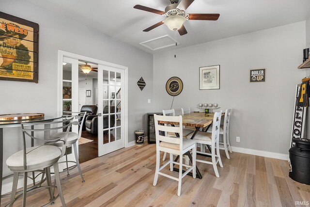 dining room with french doors, light hardwood / wood-style flooring, and ceiling fan