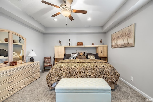 bedroom featuring light carpet and ceiling fan