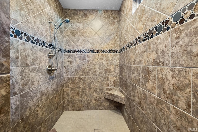 bathroom featuring a tile shower