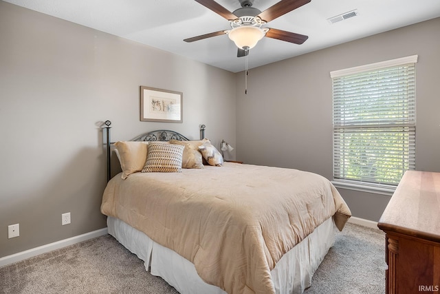 bedroom with light colored carpet and ceiling fan