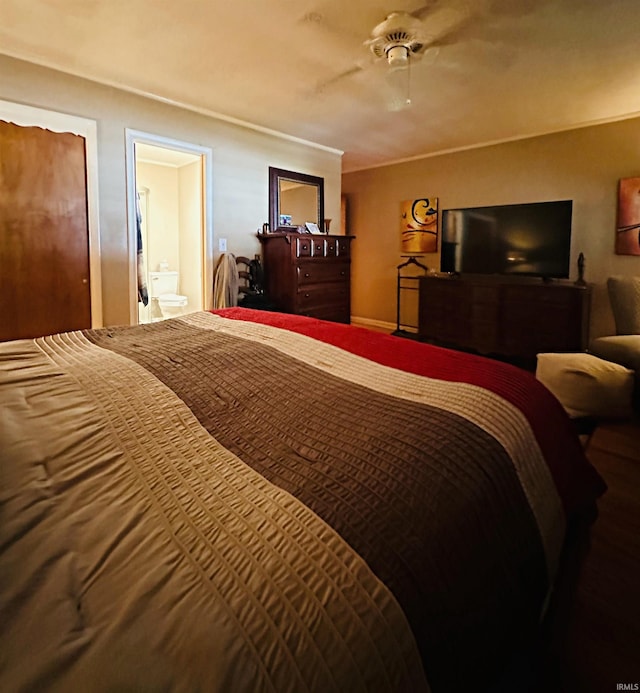 bedroom featuring ceiling fan and connected bathroom