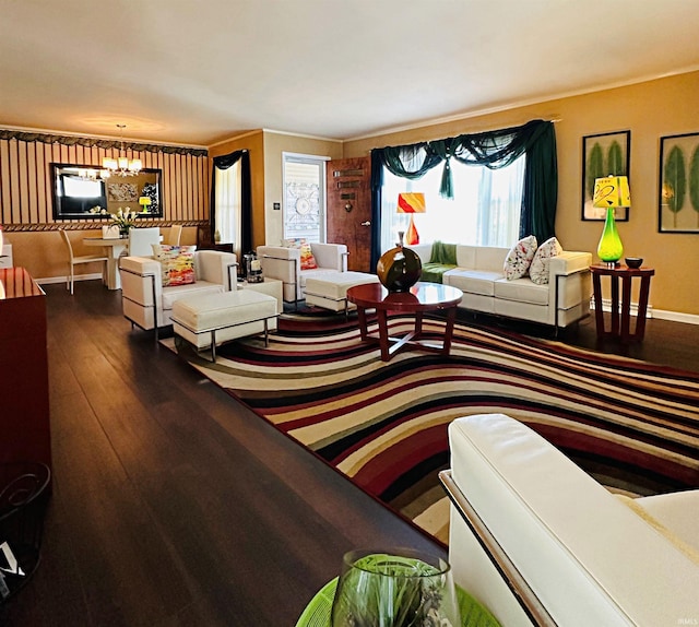 living room with a notable chandelier and hardwood / wood-style flooring