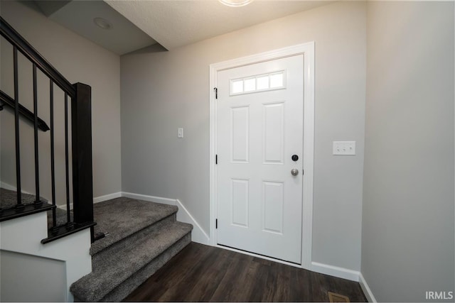 foyer featuring dark wood-type flooring