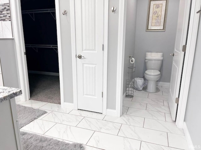 bathroom featuring toilet and vanity