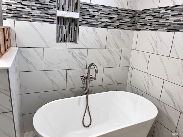 bathroom with a tub to relax in