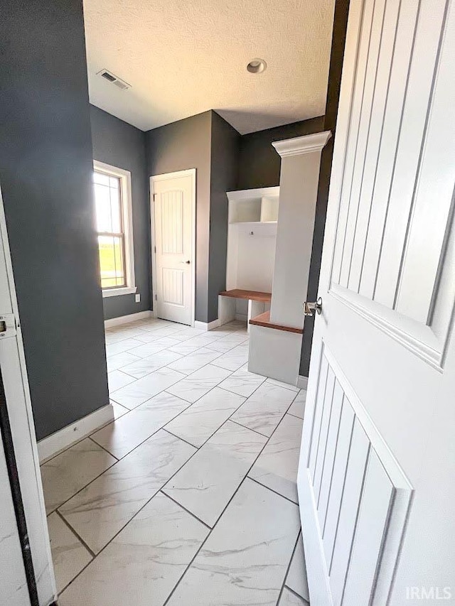 bathroom featuring a textured ceiling