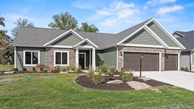 craftsman-style home with a garage and a front yard