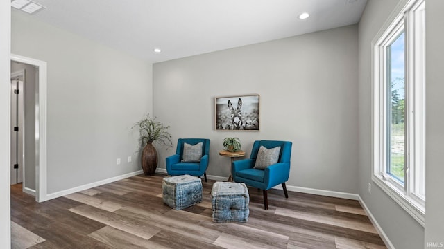 sitting room with hardwood / wood-style floors