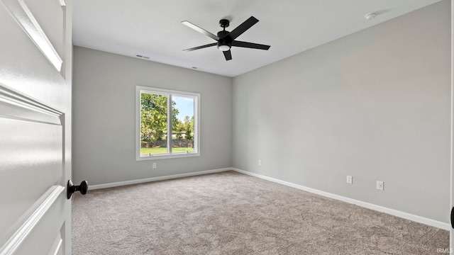 carpeted empty room with ceiling fan