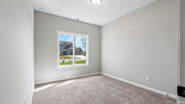 spare room featuring carpet floors