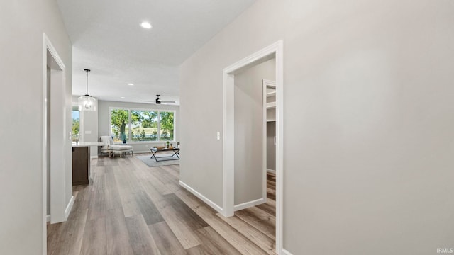 hallway with light wood-type flooring