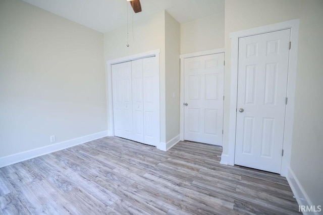 unfurnished bedroom featuring a closet, ceiling fan, and light hardwood / wood-style floors