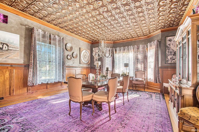 dining space featuring a chandelier and ornamental molding