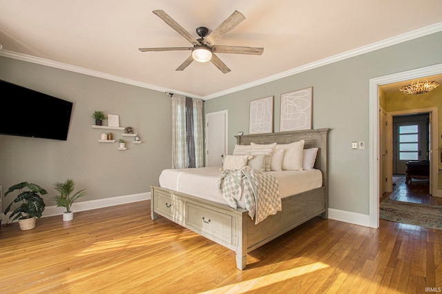 bedroom featuring crown molding, ceiling fan, and light hardwood / wood-style floors