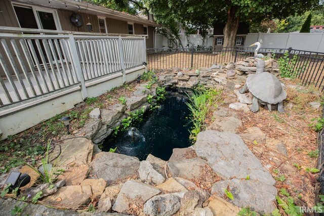 view of yard with a small pond