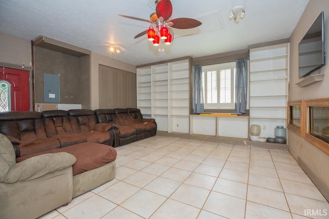 tiled living room featuring a textured ceiling and ceiling fan