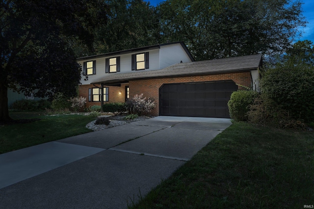 front of property with a front yard and a garage