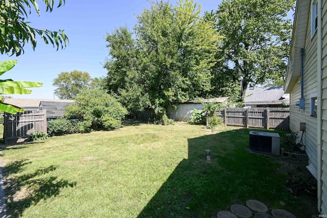 view of yard with central air condition unit