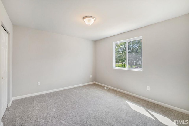 spare room featuring carpet flooring