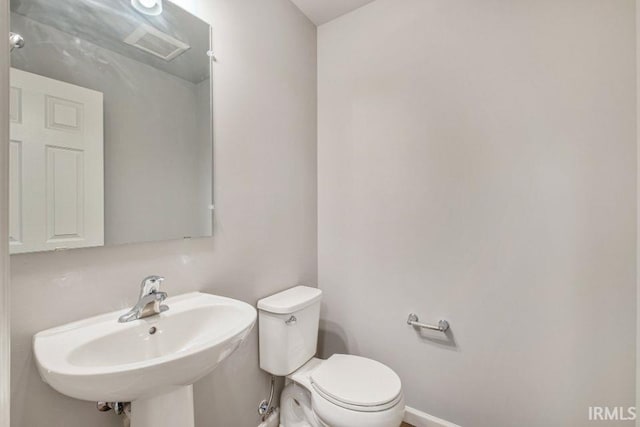 bathroom with sink and toilet