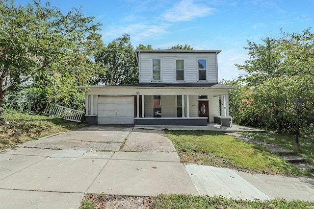 view of front of property featuring a garage and a porch