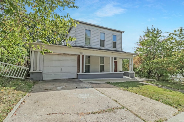 view of front of house with covered porch and a garage