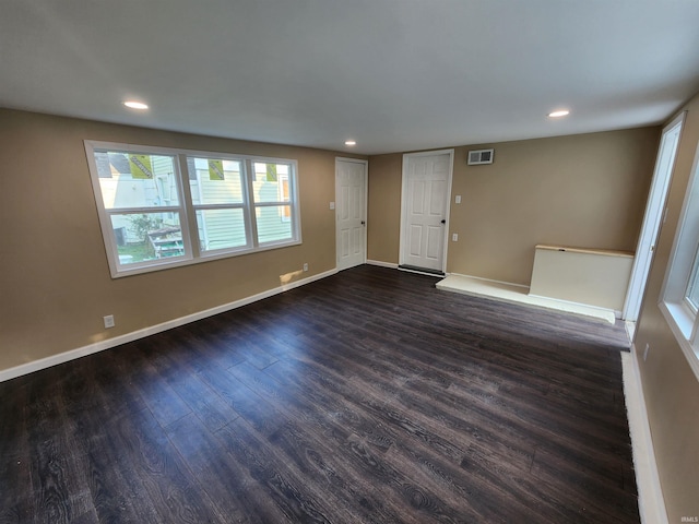 unfurnished room featuring dark hardwood / wood-style floors