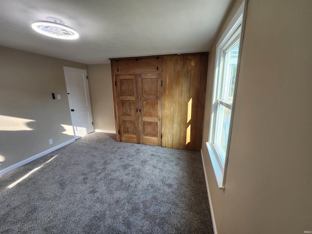 unfurnished bedroom with carpet floors