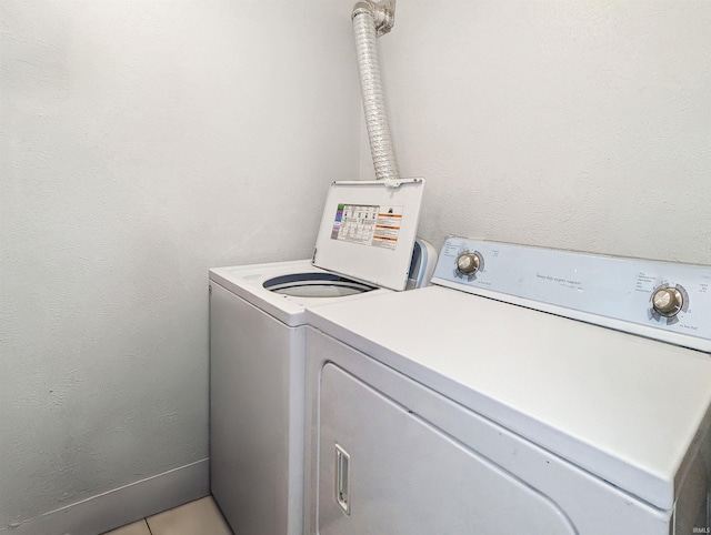 clothes washing area featuring washing machine and clothes dryer