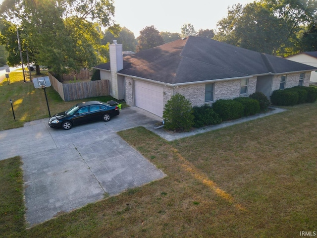 ranch-style home with a garage and a front yard