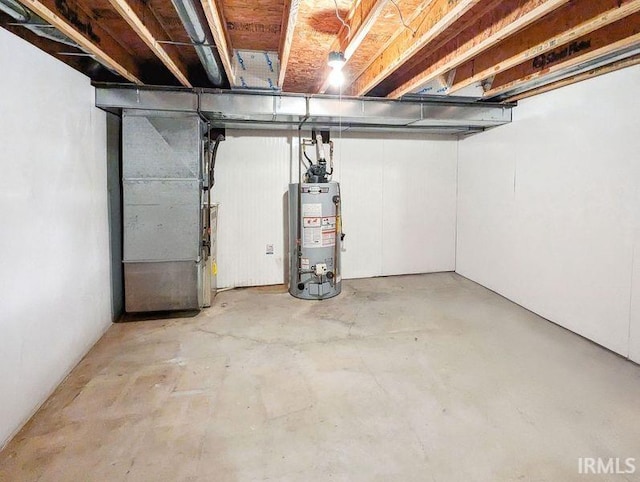 basement with gas water heater and heating unit