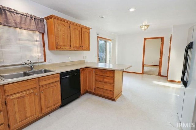 kitchen with dishwasher, refrigerator, kitchen peninsula, and sink