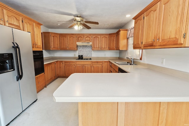 kitchen with black appliances, ceiling fan, kitchen peninsula, and sink