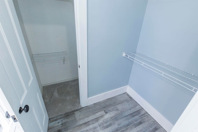 spacious closet featuring light hardwood / wood-style floors