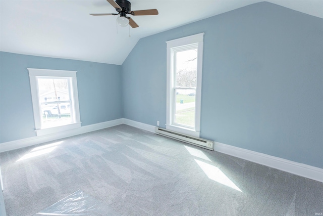 bonus room featuring light carpet, baseboard heating, lofted ceiling, and ceiling fan