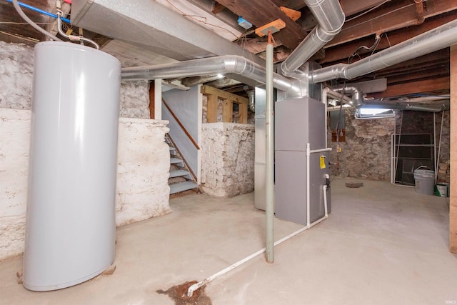 basement featuring heating unit and water heater